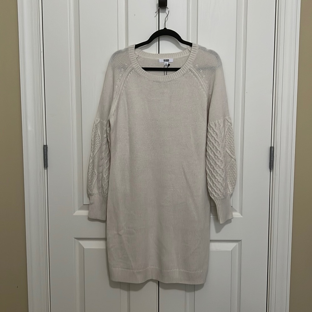 Cream sweater dress with balloon sleeves.
